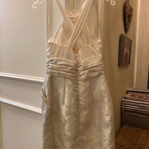 Elegant white cocktail dress with pockets